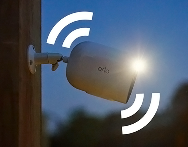 The Arlo Go 2 security cameras against a wall with effect showing the integrated siren.